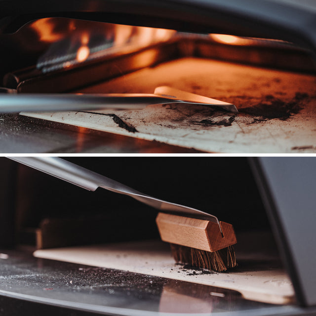 Ofenszene Pizzastein wird abgeschabt und Reste werden ausgebürstet